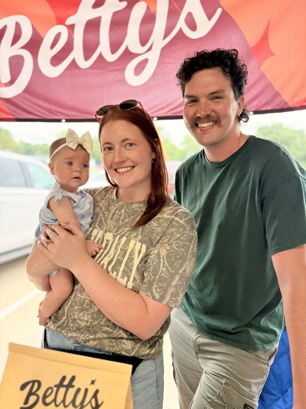 A family at the Betty's Bagels stall on a Saturday morning.